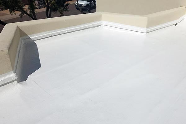 White fire-rated TPO roof with skylights on a New Mexico home — detail 2