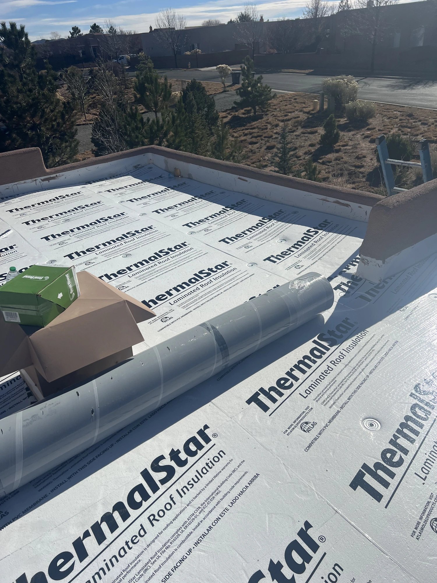 White fire-rated TPO roof with skylights on a New Mexico home — detail 3